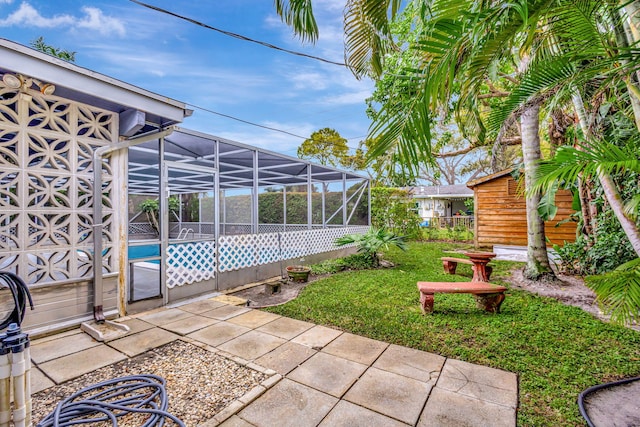 view of patio / terrace featuring glass enclosure