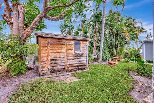 view of shed with fence