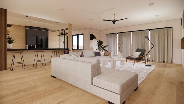 living room with a ceiling fan and light wood-style floors