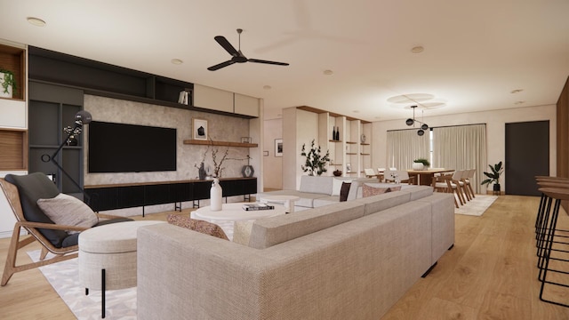 living room with light wood-style flooring and ceiling fan