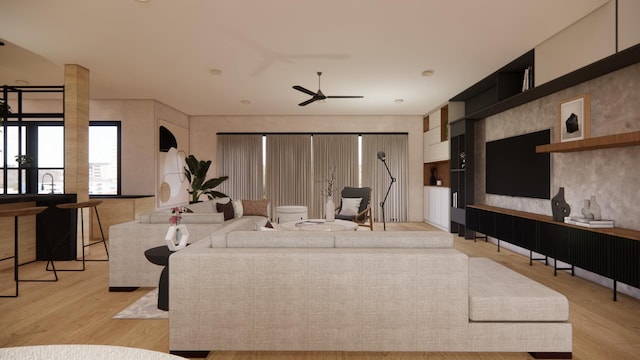 living area with a ceiling fan and light wood finished floors