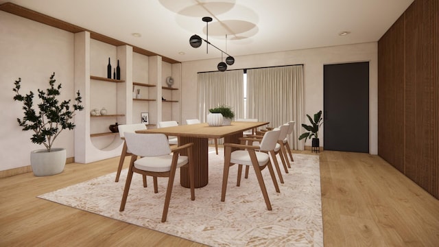 dining area featuring light wood-style flooring