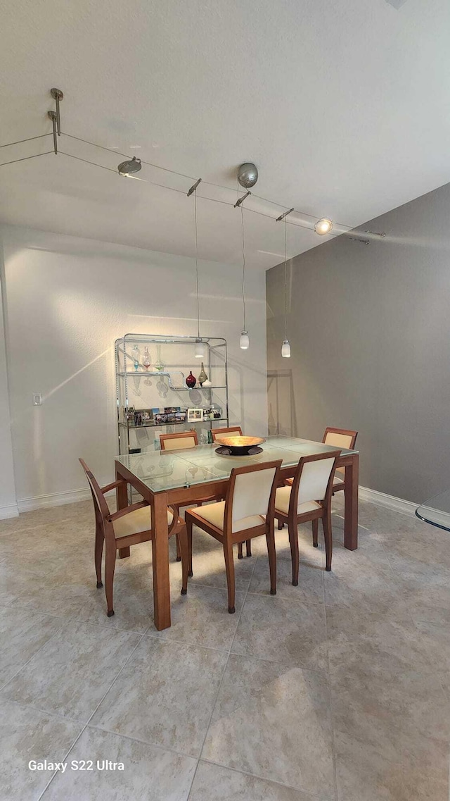 dining room with baseboards