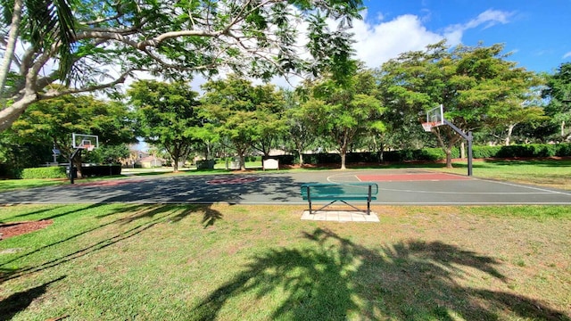 view of sport court featuring community basketball court and a lawn