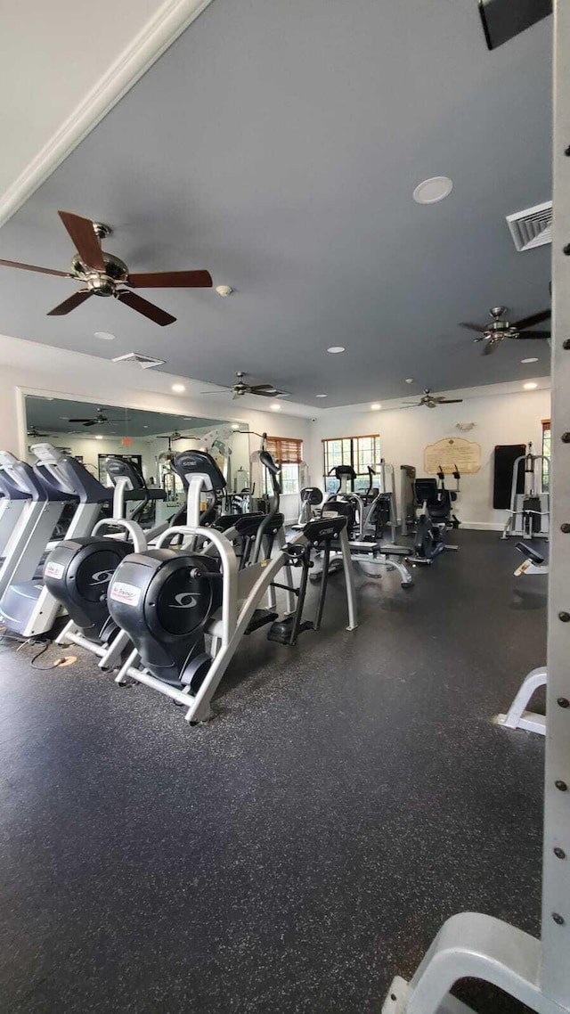 workout area featuring visible vents and a ceiling fan