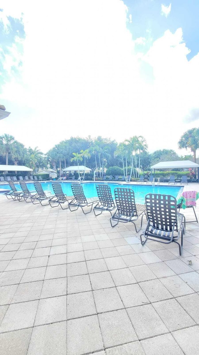 pool featuring a patio area