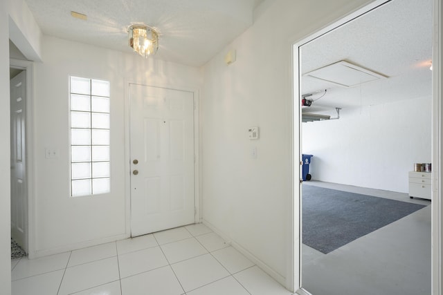 foyer entrance featuring a textured ceiling