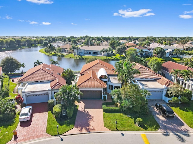 aerial view featuring a water view and a residential view