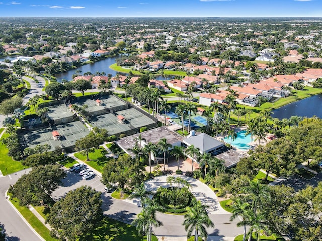 drone / aerial view with a water view and a residential view