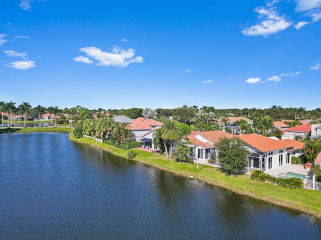 bird's eye view with a water view and a residential view