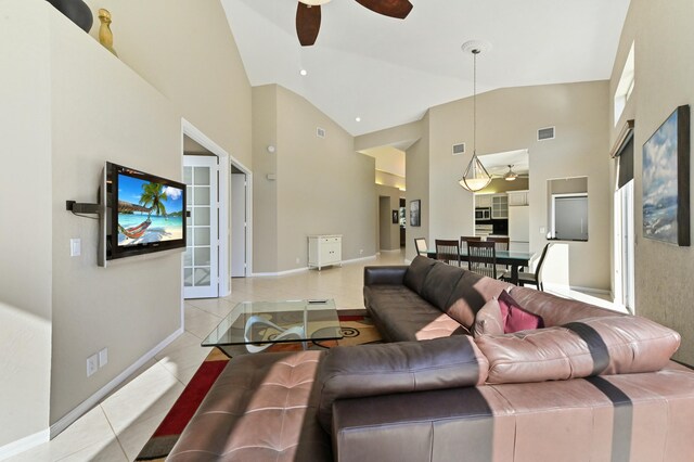 dining space featuring light tile patterned floors, visible vents, and baseboards