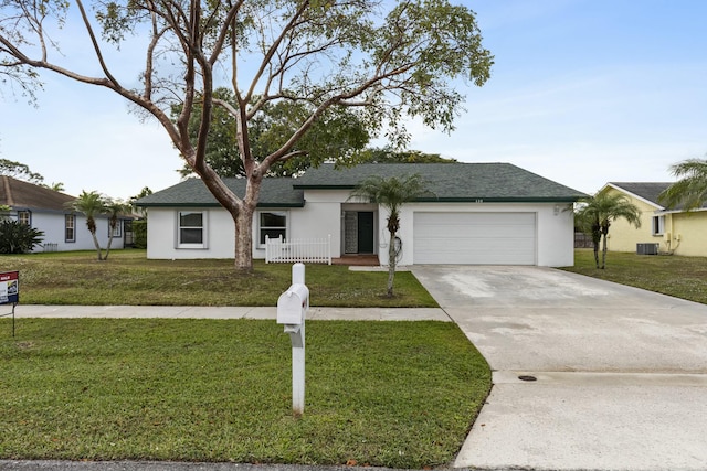 ranch-style home with an attached garage, driveway, a front lawn, and stucco siding