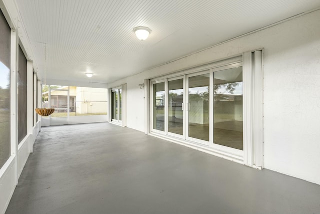 unfurnished sunroom with a healthy amount of sunlight