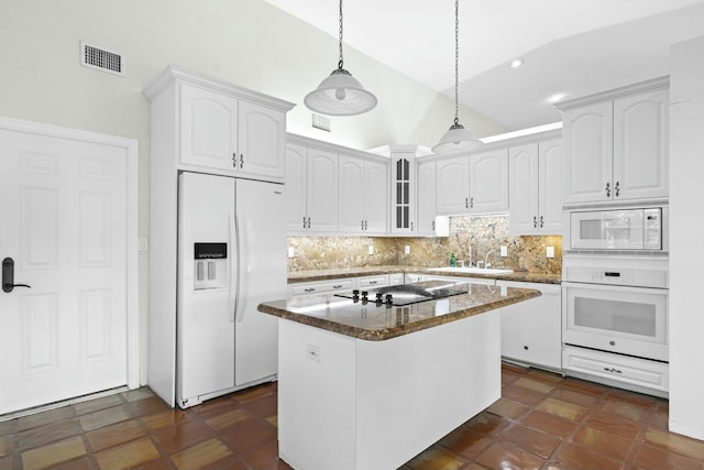 kitchen featuring white appliances, visible vents, a sink, and white cabinets