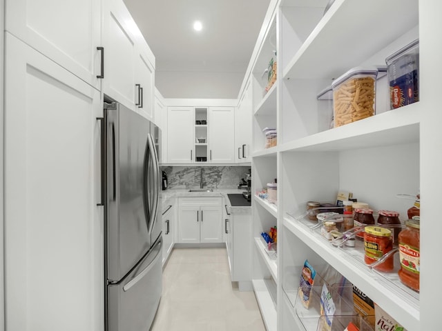 pantry featuring a sink