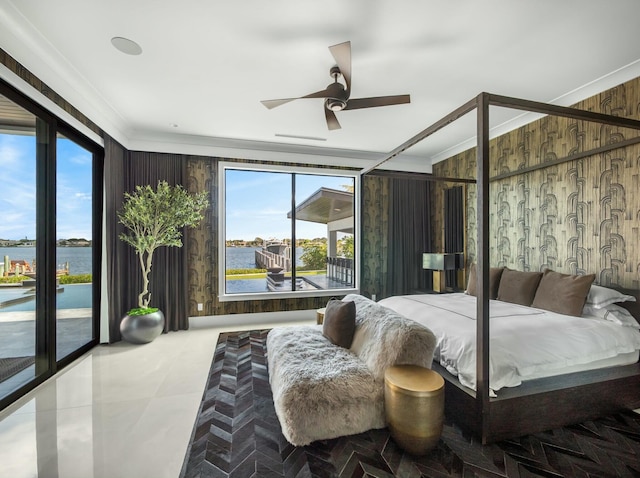 bedroom featuring wood walls, a water view, ceiling fan, and access to outside