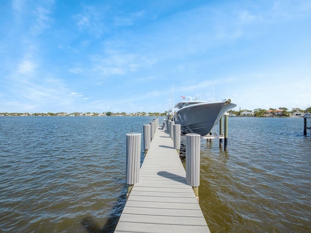 dock area with a water view and boat lift