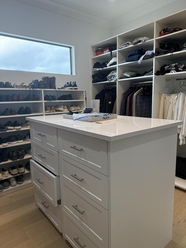 walk in closet featuring light wood finished floors