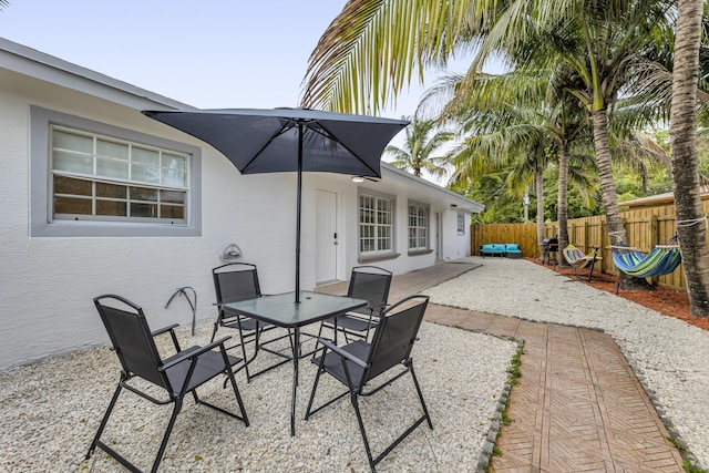 view of patio featuring fence