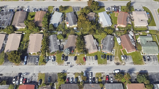 birds eye view of property with a residential view