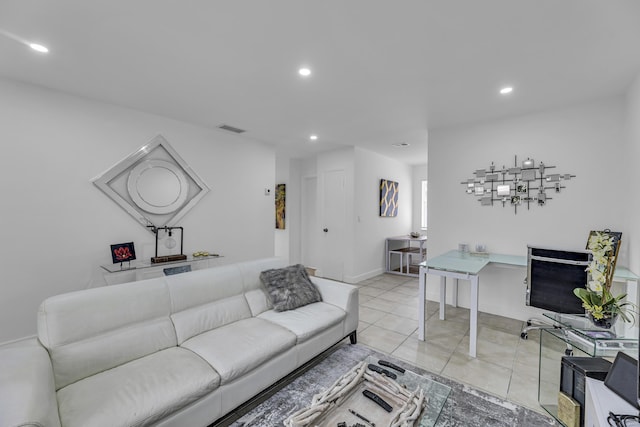 living area with light tile patterned floors, baseboards, visible vents, and recessed lighting