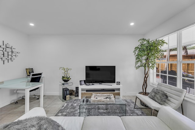 living area with light tile patterned floors, recessed lighting, and baseboards