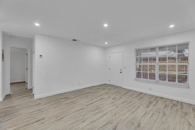 unfurnished room with recessed lighting, visible vents, and light wood finished floors