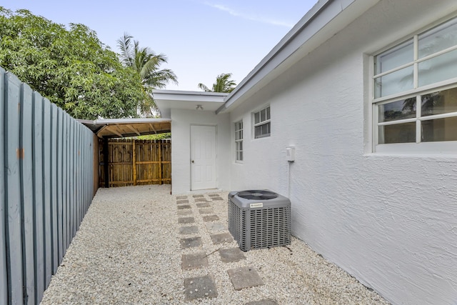 view of patio / terrace featuring cooling unit and fence