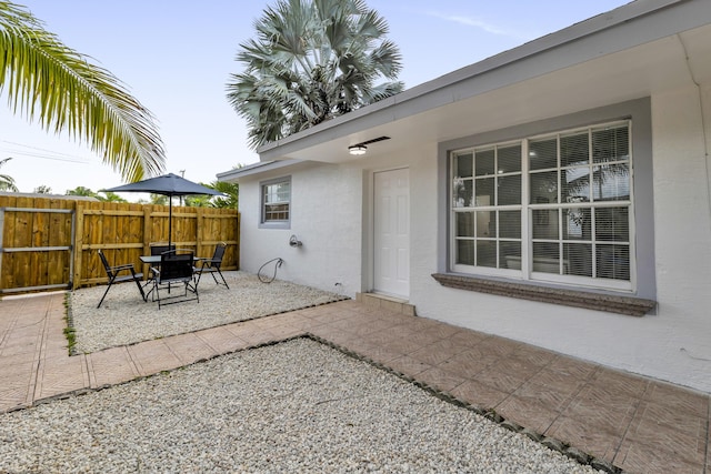 view of patio / terrace featuring fence