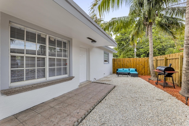 view of patio / terrace with outdoor lounge area, a fenced backyard, and area for grilling