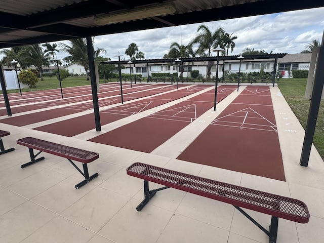 view of property's community featuring shuffleboard