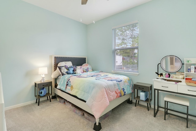 bedroom featuring baseboards, ceiling fan, and carpet