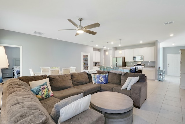 living area featuring recessed lighting, visible vents, ceiling fan, and light tile patterned flooring