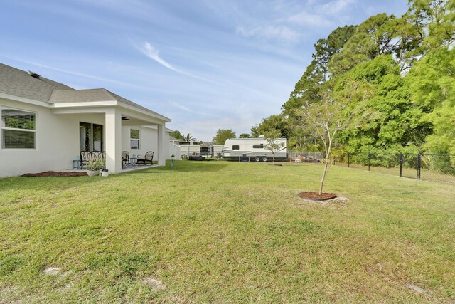 view of patio / terrace featuring a fenced backyard, an outdoor living space, and a ceiling fan