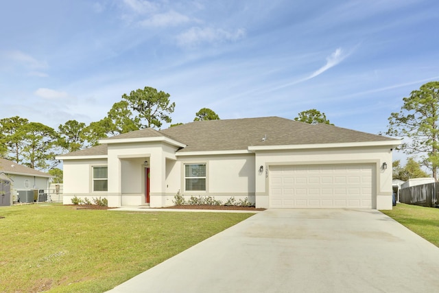 view of front of house featuring a front yard, concrete driveway, stucco siding, an attached garage, and central AC