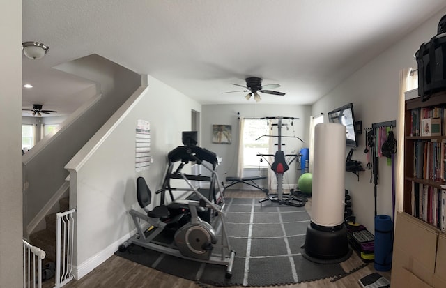 6101 NW Painted Bunting Ct, Port Saint Lucie, FL 34986 - exercise room with ceiling fan, baseboards, and healthy amount of natural light