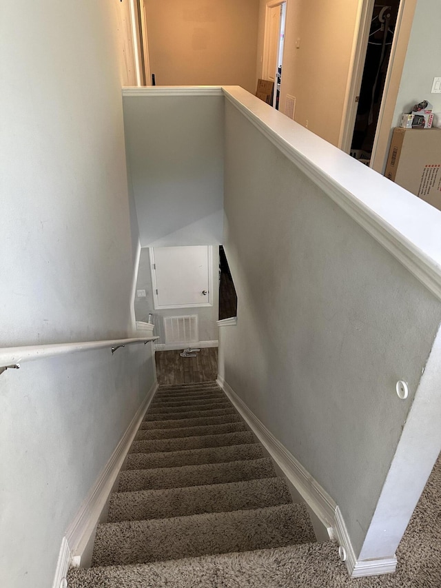 6101 NW Painted Bunting Ct, Port Saint Lucie, FL 34986 - stairway featuring carpet flooring and baseboards