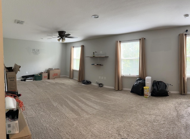 6101 NW Painted Bunting Ct, Port Saint Lucie, FL 34986 - unfurnished living room with ceiling fan, carpet flooring, and baseboards