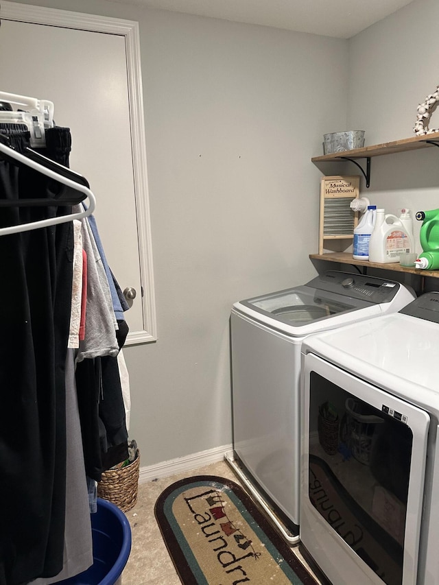 6101 NW Painted Bunting Ct, Port Saint Lucie, FL 34986 - washroom with washing machine and clothes dryer and baseboards