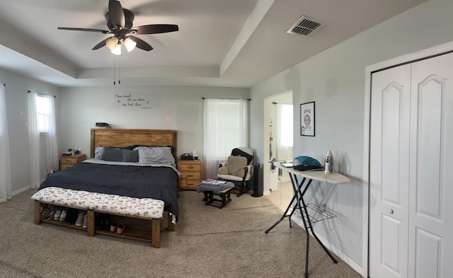 6101 NW Painted Bunting Ct, Port Saint Lucie, FL 34986 - bedroom with carpet, a tray ceiling, a ceiling fan, connected bathroom, and baseboards