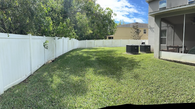 6101 NW Painted Bunting Ct, Port Saint Lucie, FL 34986 - view of yard with a sunroom and cooling unit