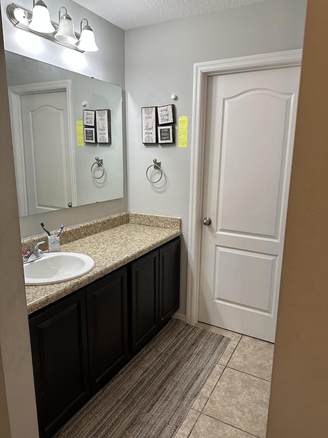 6101 NW Painted Bunting Ct, Port Saint Lucie, FL 34986 - bathroom with vanity and tile patterned floors