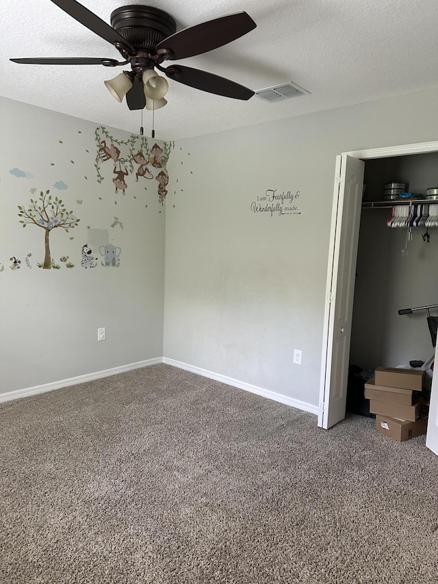 6101 NW Painted Bunting Ct, Port Saint Lucie, FL 34986 - unfurnished bedroom featuring carpet, baseboards, ceiling fan, and a closet