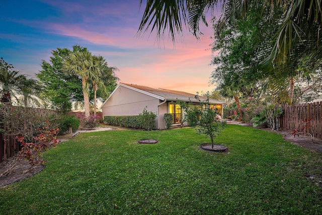 view of yard with a fenced backyard