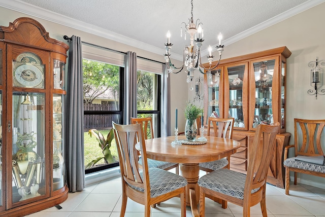 dining room featuring light tile patterned floors, ornamental molding, and a textured ceiling