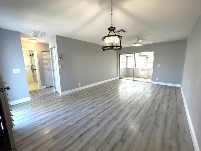 interior space featuring light wood-type flooring, baseboards, and visible vents