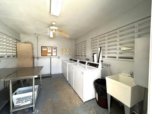 shared laundry area featuring ceiling fan, a sink, and separate washer and dryer