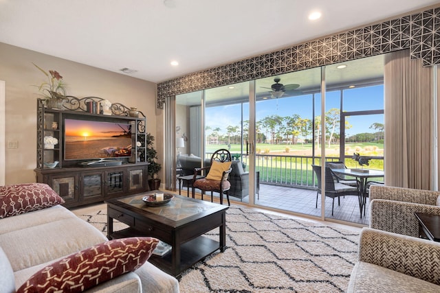 living room featuring a ceiling fan, wood finished floors, and recessed lighting