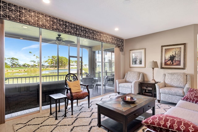 living room with a sunroom, ceiling fan, and recessed lighting
