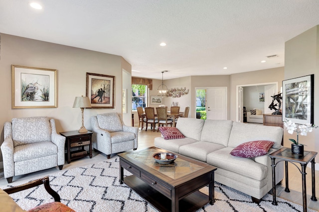 living room with recessed lighting and light wood-style flooring